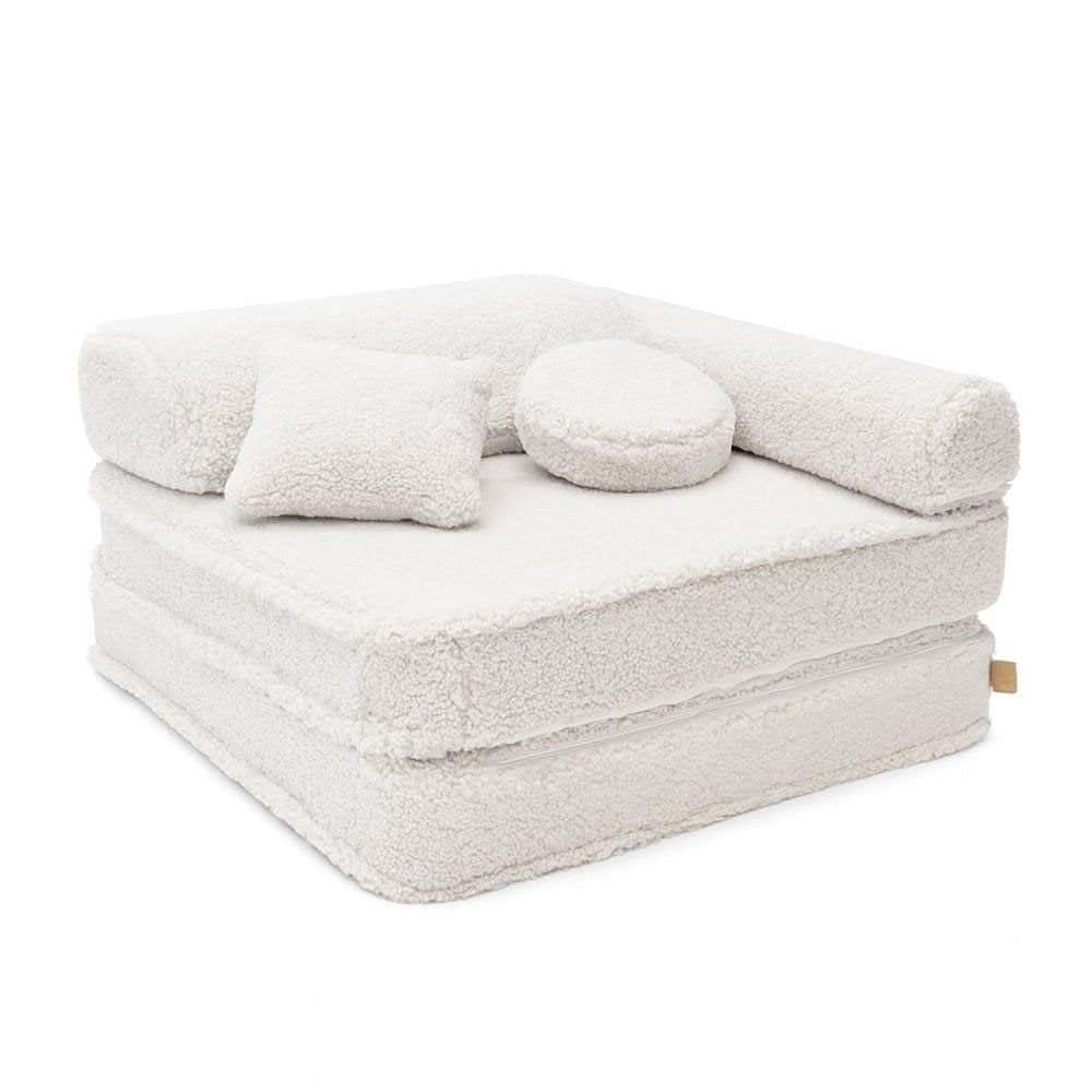 1. Modular children's chair in bearly off-white with double mattress, headrest, armrest, and two cushions on a clean white background