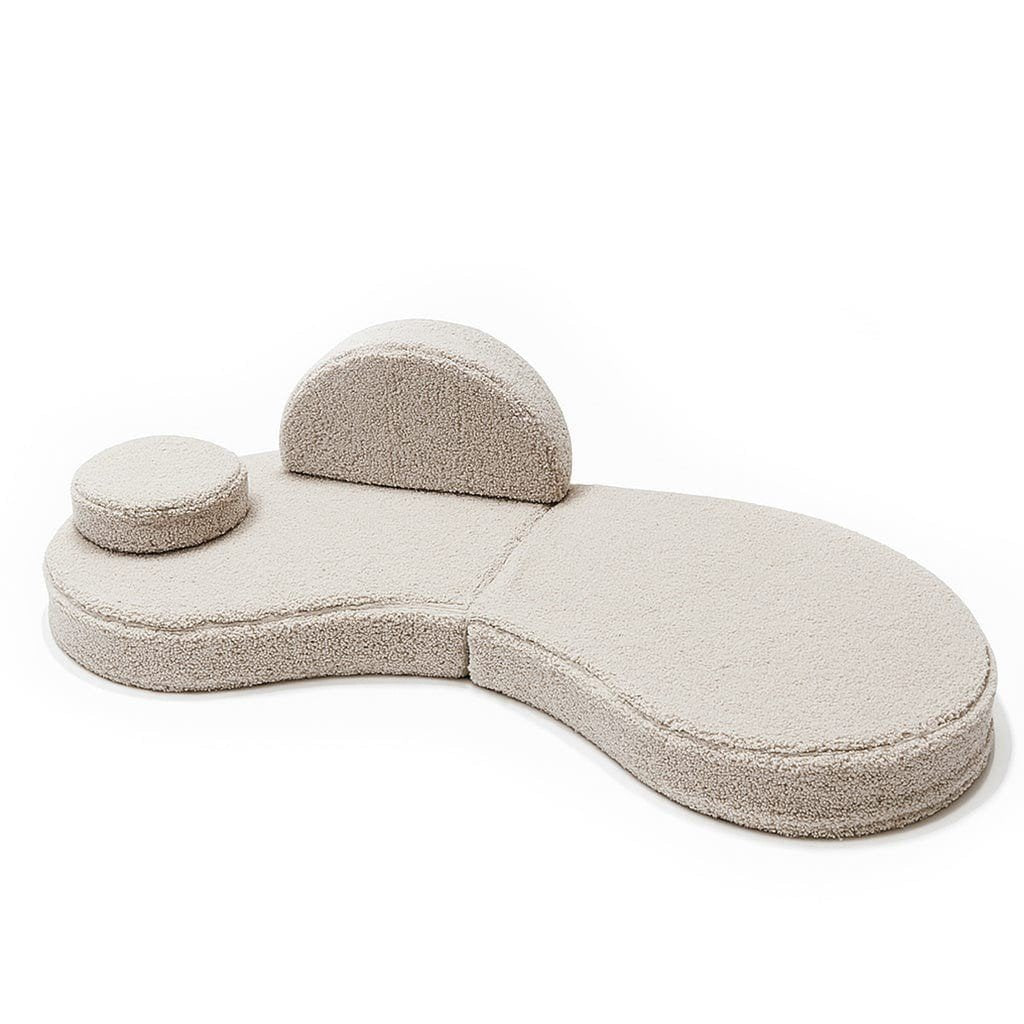 3. Modular kids' sofa in Bearly light gray with one backrest and one round cushion, arranged asymmetrically