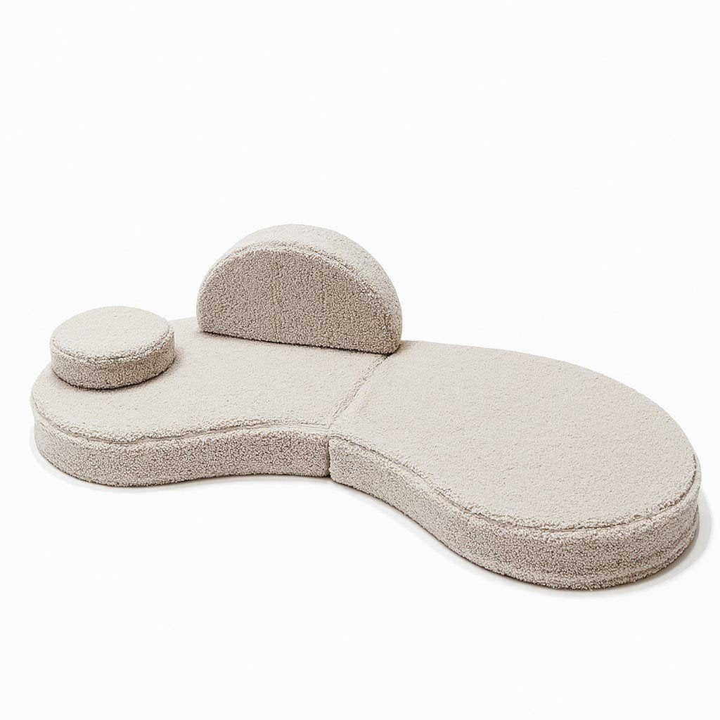 3. Modular kids' sofa in Bearly light gray with one backrest and one round cushion, arranged asymmetrically