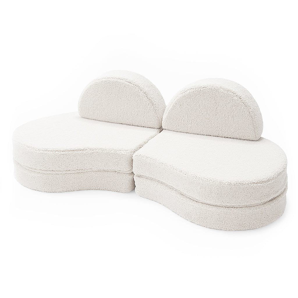 2. Modular kids' sofa in Bearly off-white, shown in a two-piece configuration with rounded backrests on a white background