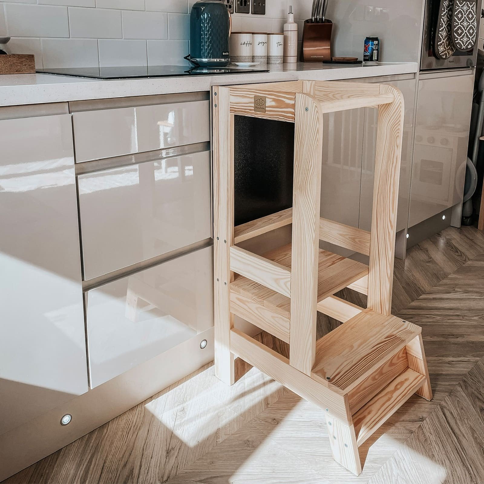 3. Side view of wooden kitchen helper in natural finish against kitchen cabinets