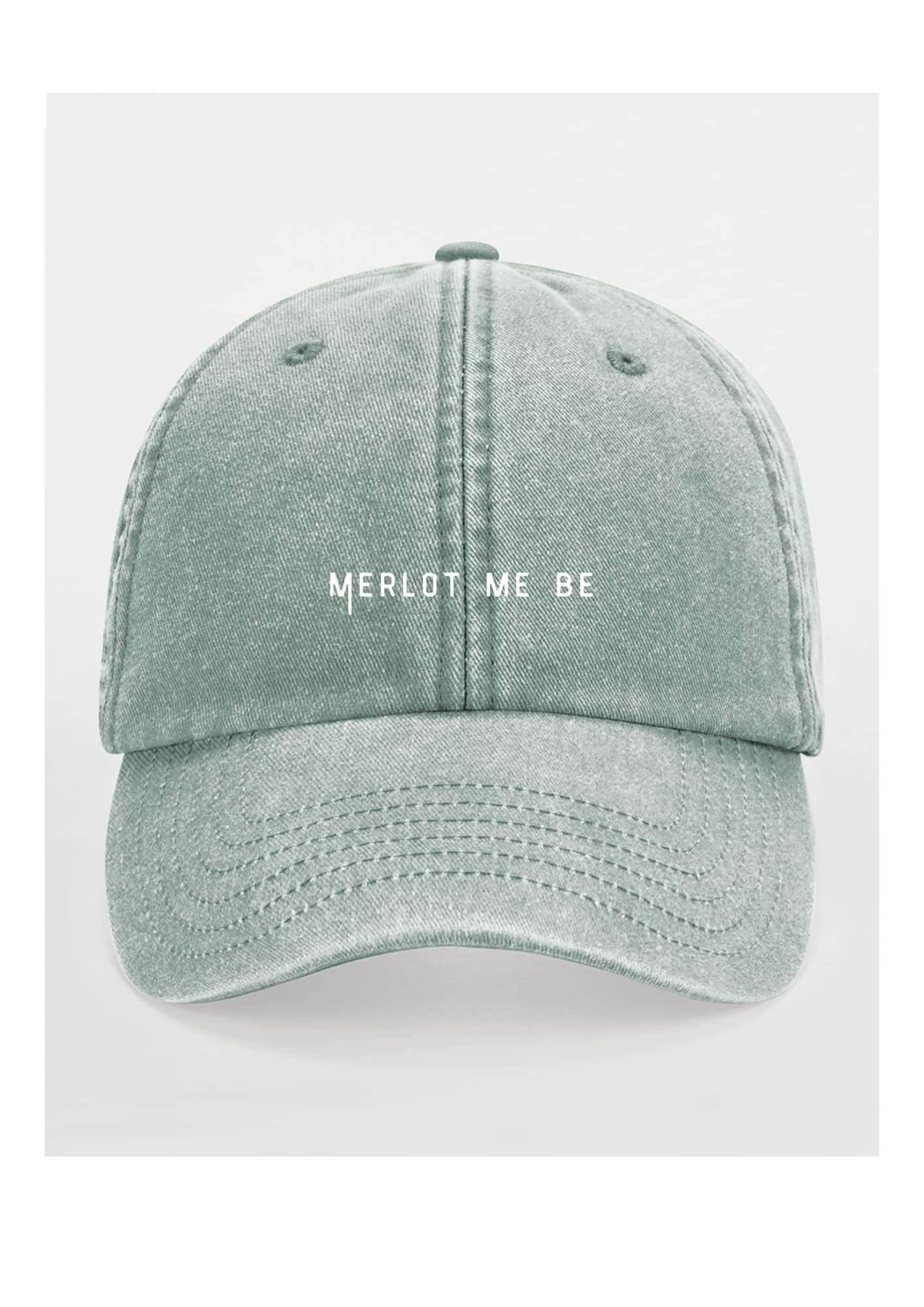 2. Green Merlot Me Be cap by Black Giraffe Brand with white text on front, studio background
