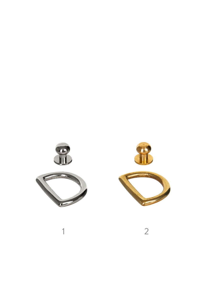 3. Close-up of silver and gold metal hardware options for Stella Soomlais bags on white background
