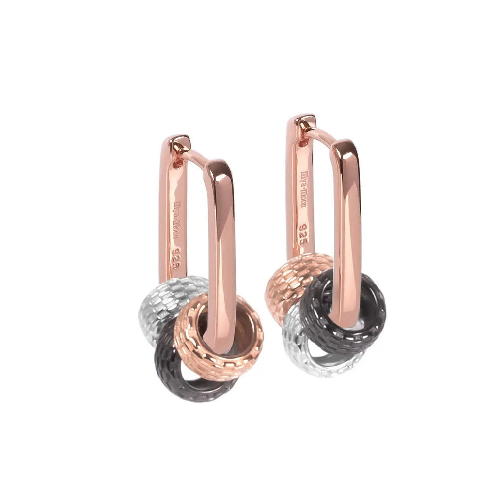 1. MyaMoon Metropolitan Hoops Rolling Charm in rose gold and silver, featuring versatile design with additional charms, shown in studio setting