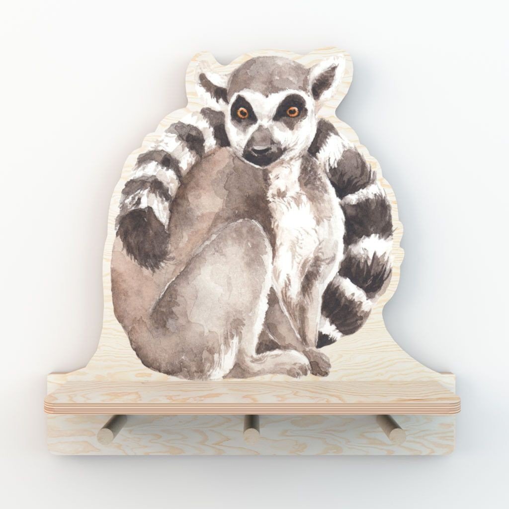 2. Studio shot of Dekornik mini wall shelf with lemur design, featuring three pegs on a light plywood background
