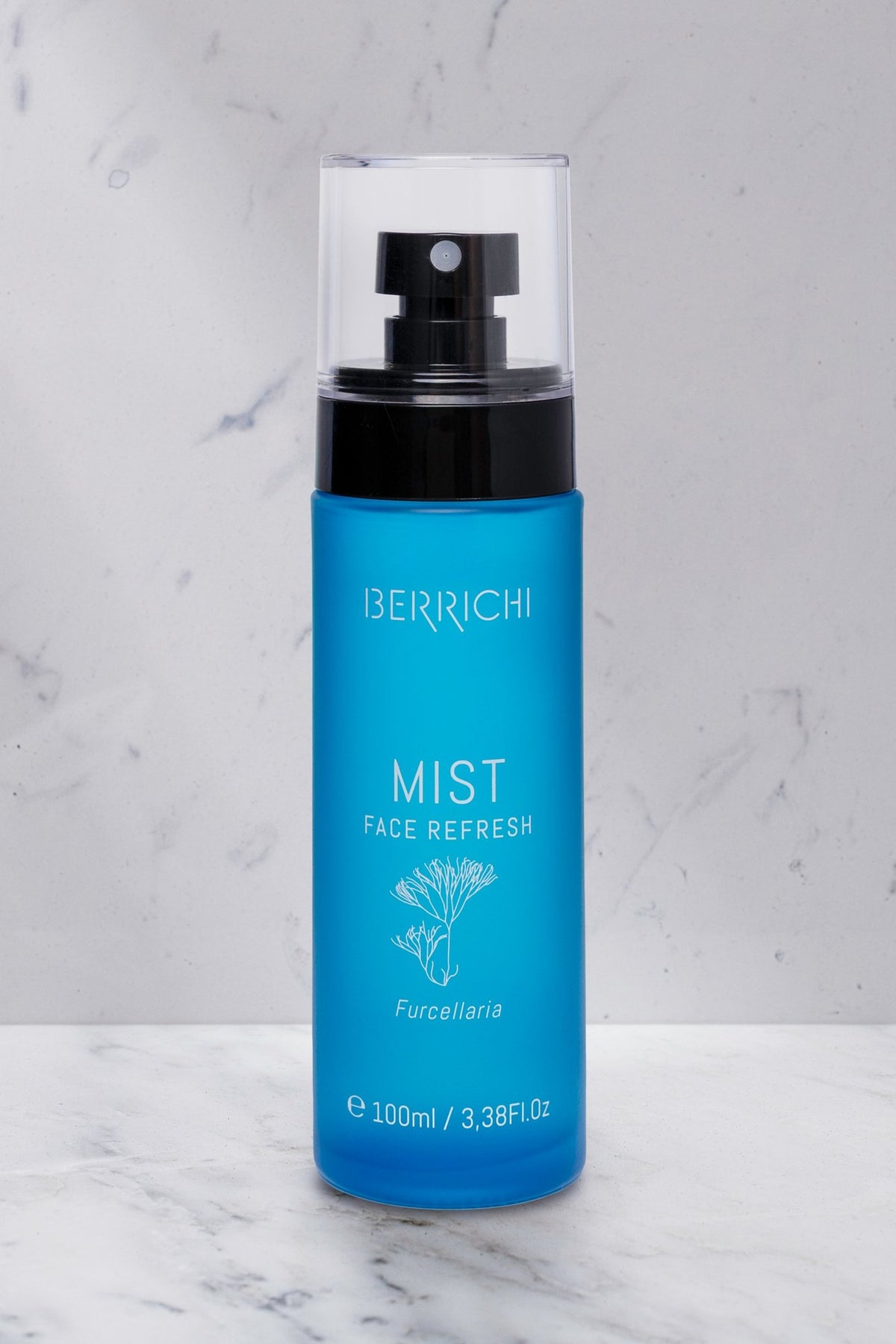6. Berrichi MIST Face Spray bottle on marble surface, showcasing sleek design