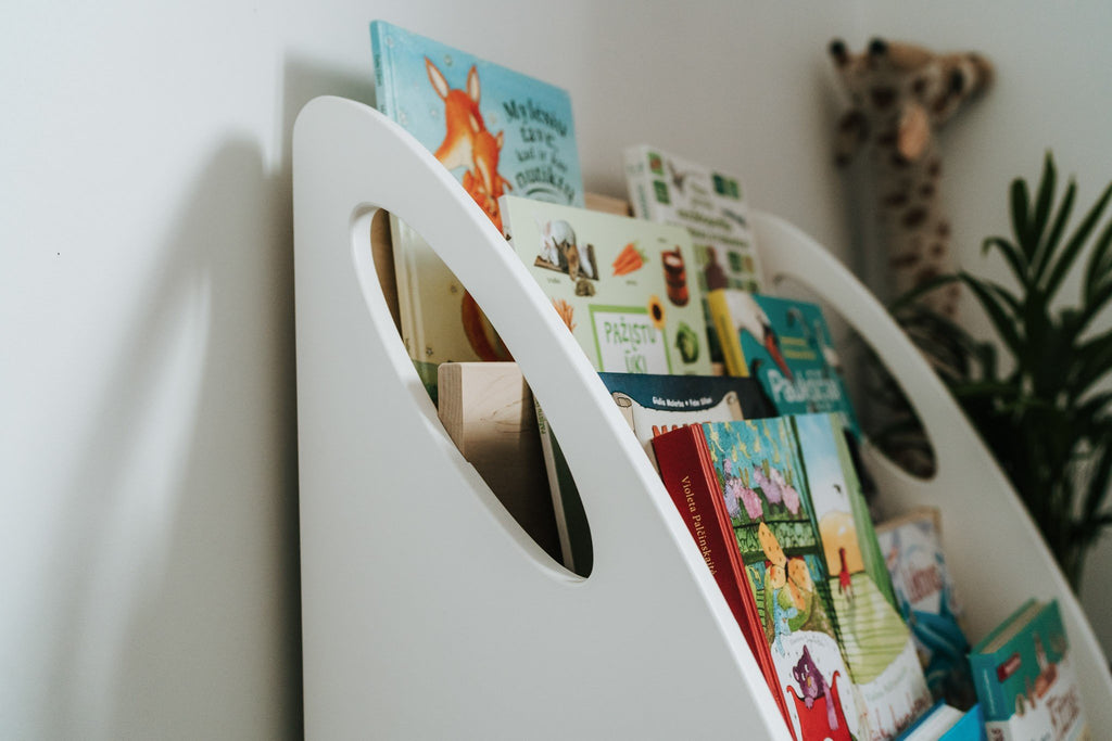 6. Close-up of Montessori bookshelf showing book covers and white side panels