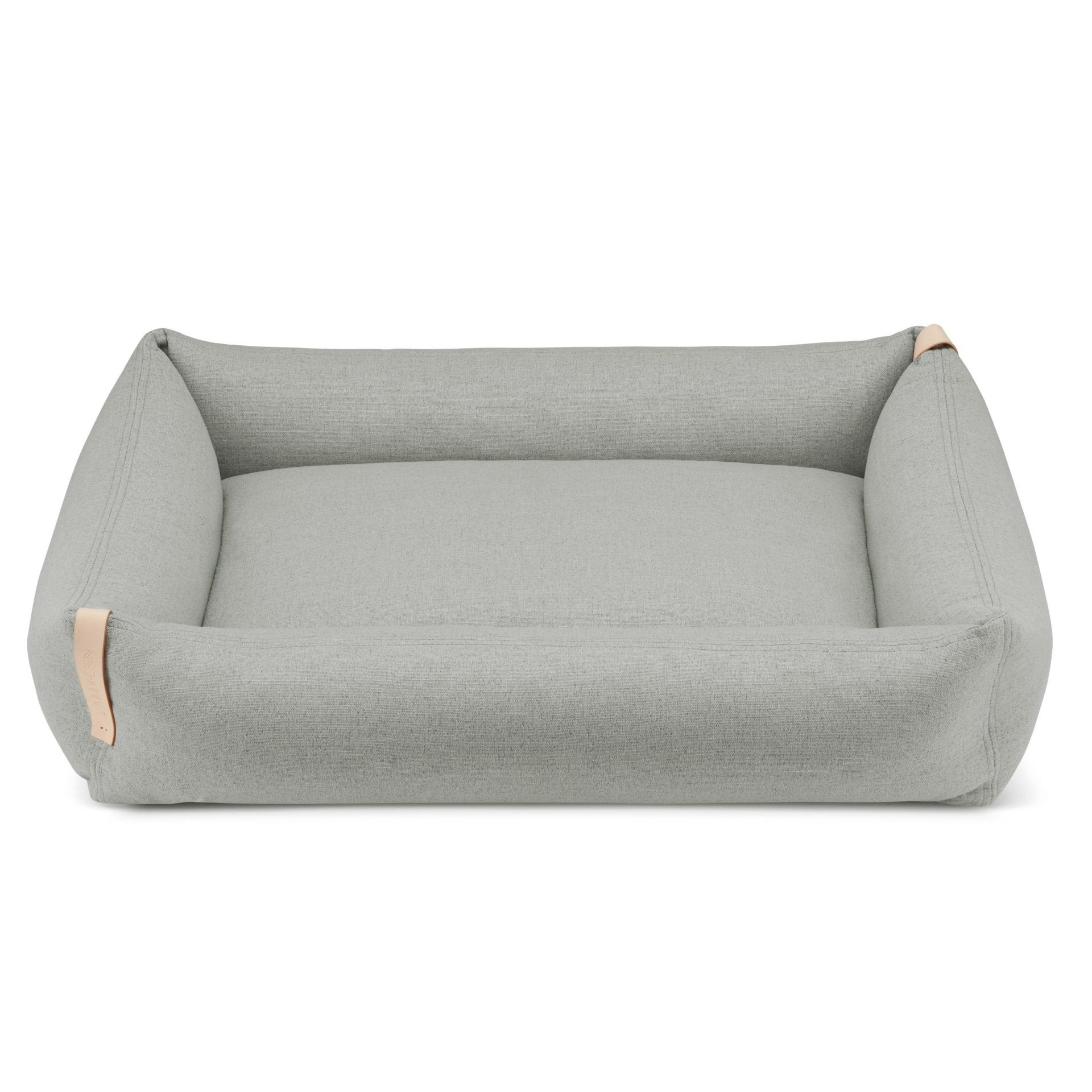 2. Grey Moe dog bed by Labbvenn with a minimalist design, featuring a rectangular shape and natural leather accents, shown on a white background.