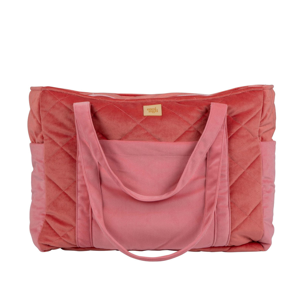 2. Front view of pink quilted weekender bag with multiple pockets and moi mili logo in studio setting