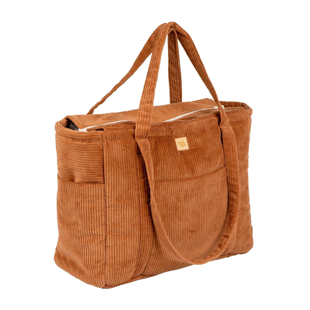 4. Studio shot of caramel velvet weekender bag with multiple pockets and zipper closure