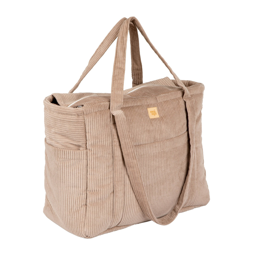 2. Side view of latte-colored velvet weekender bag with moi mili logo and zipper closure