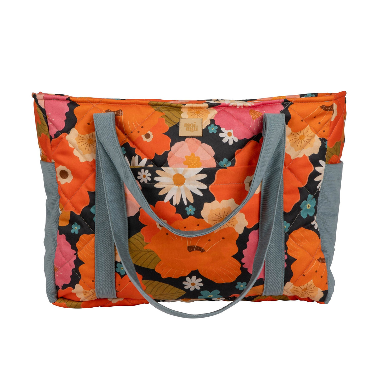 2. Studio shot of colorful floral weekender bag with blue straps, featuring orange, pink, and white flowers on a black background.