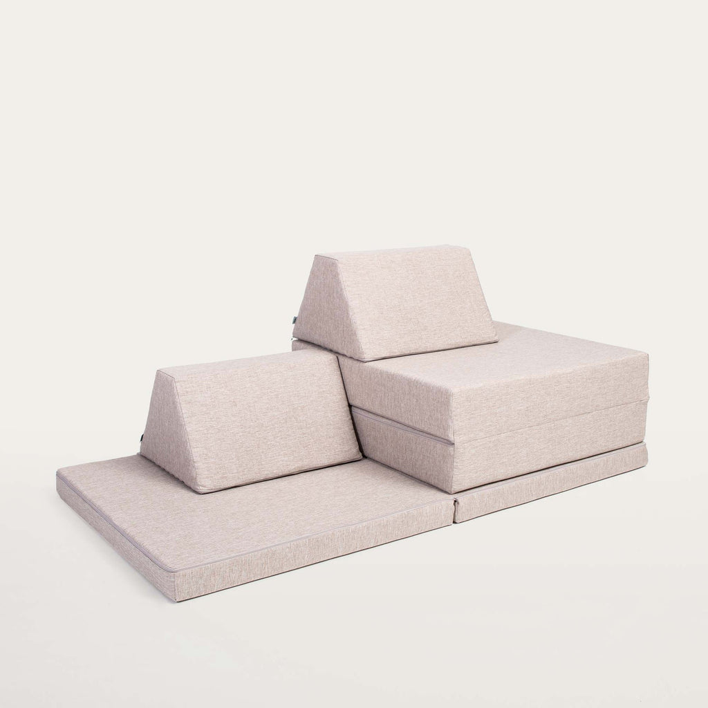 12. Beige Monboxy play mattress set with trapezoidal pillows on a white background