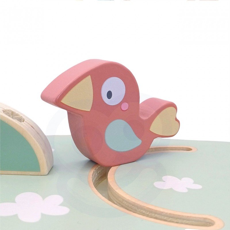7. Close-up of a pink bird figure on the Woopie Montessori 4-in-1 activity tree, part of the interactive play features.