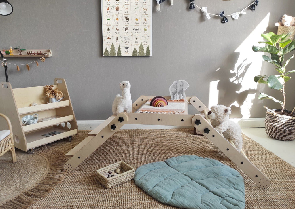 13. Montessori climbing set in a folded position with a whiteboard back, isolated on a white background.