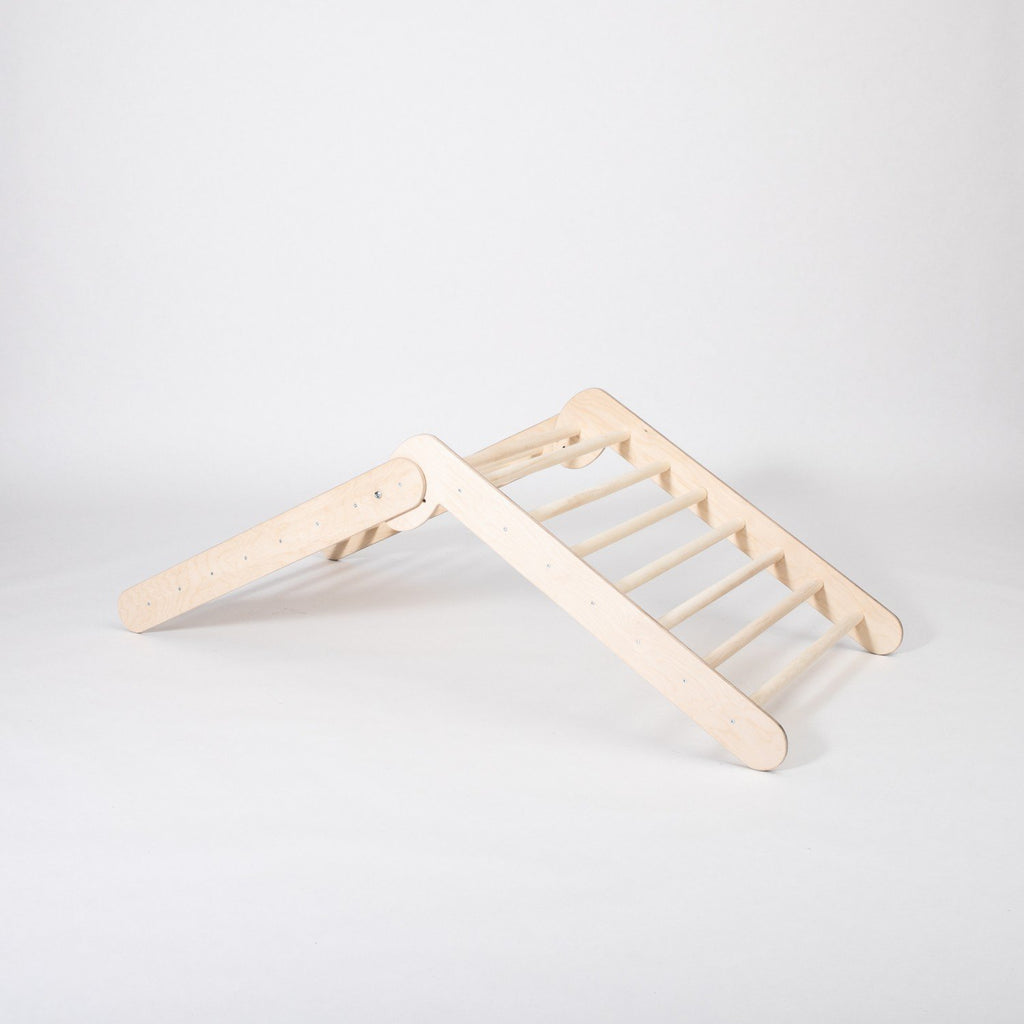 5. Montessori Climbing Triangle in studio setting showing its two slope levels and wooden structure