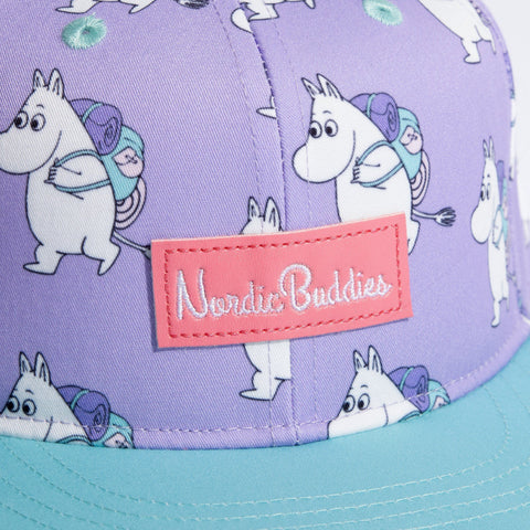 2. Close-up of Moomin Adventure Kids Flat Cap showing NordicBuddies logo and Moomin character pattern