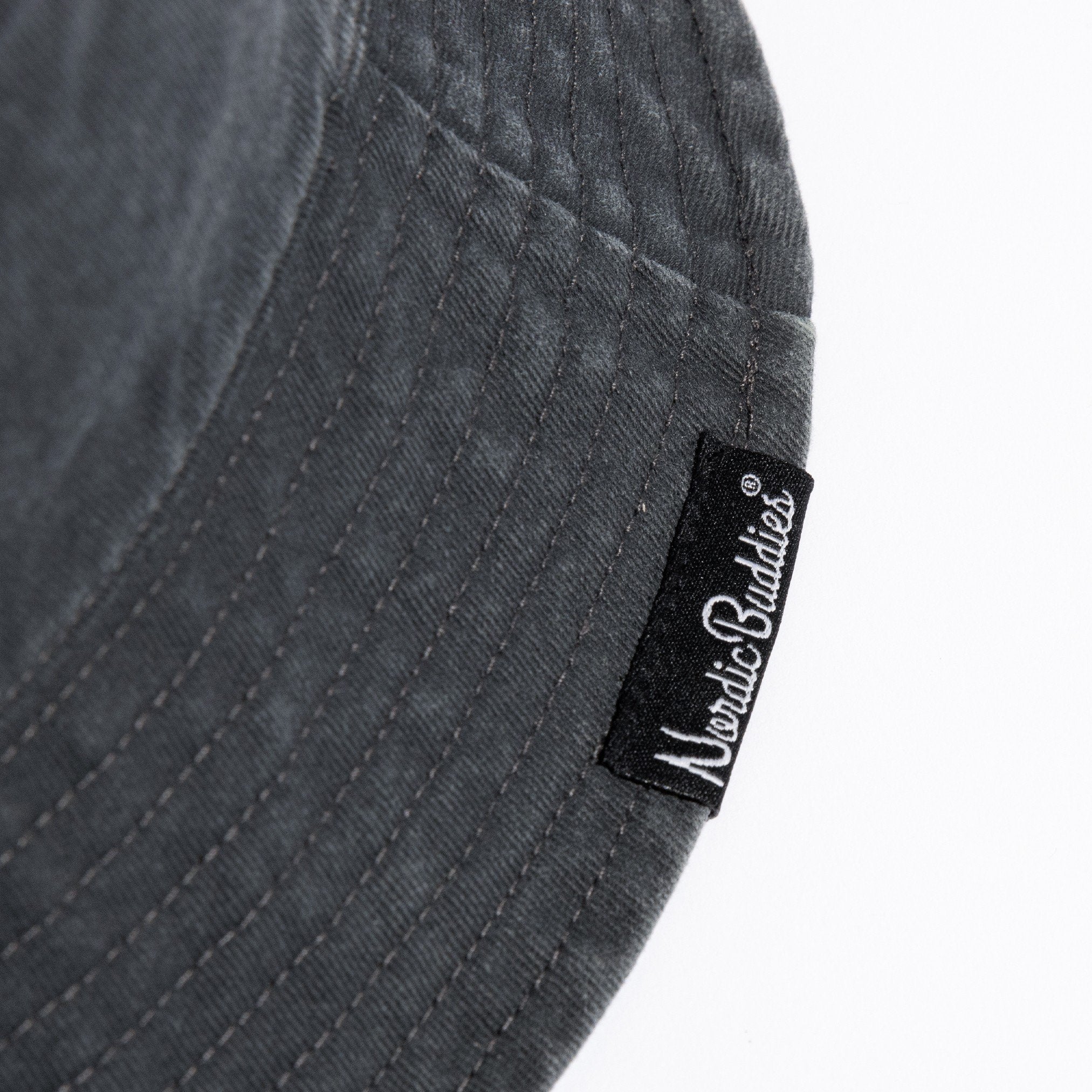 3. Close-up of NordicBuddies label on black washed denim bucket hat