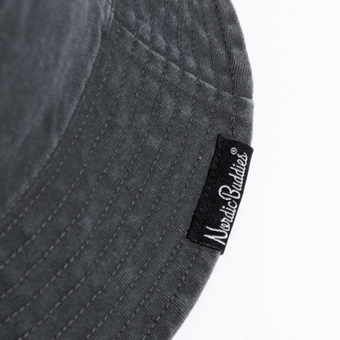 3. Close-up of NordicBuddies label on black washed denim bucket hat