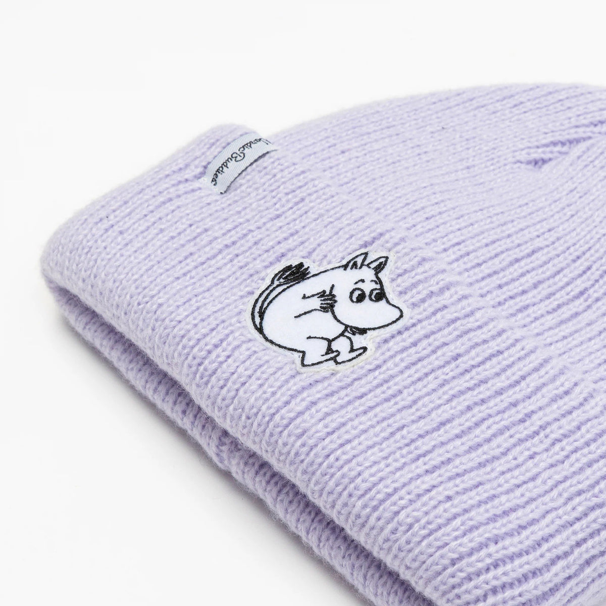 3. Close-up of lavender Moomintroll beanie showing felt patch and ribbed texture