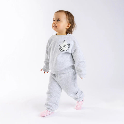 1. Toddler wearing grey Moomintroll kids college set with decorative drawstring, walking on white background