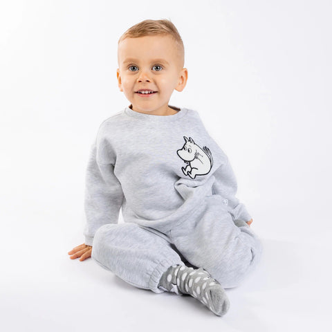 1. Toddler sitting wearing grey Moomintroll kids college set with cartoon character, on white background