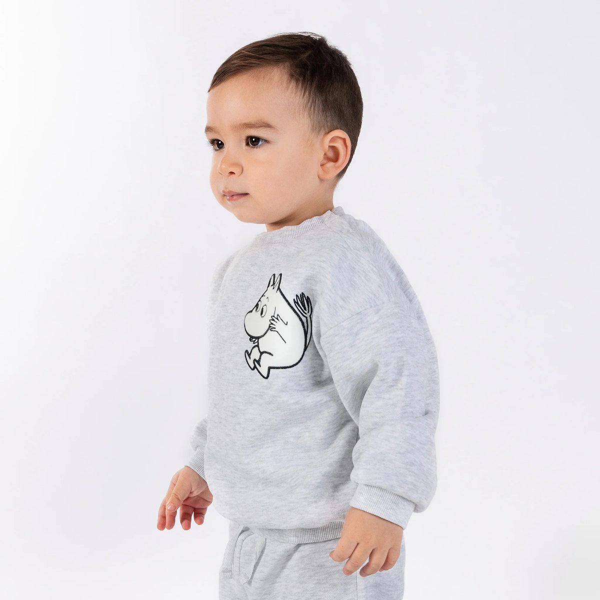 1. Toddler wearing grey Moomintroll kids college set with cartoon character, standing on white background