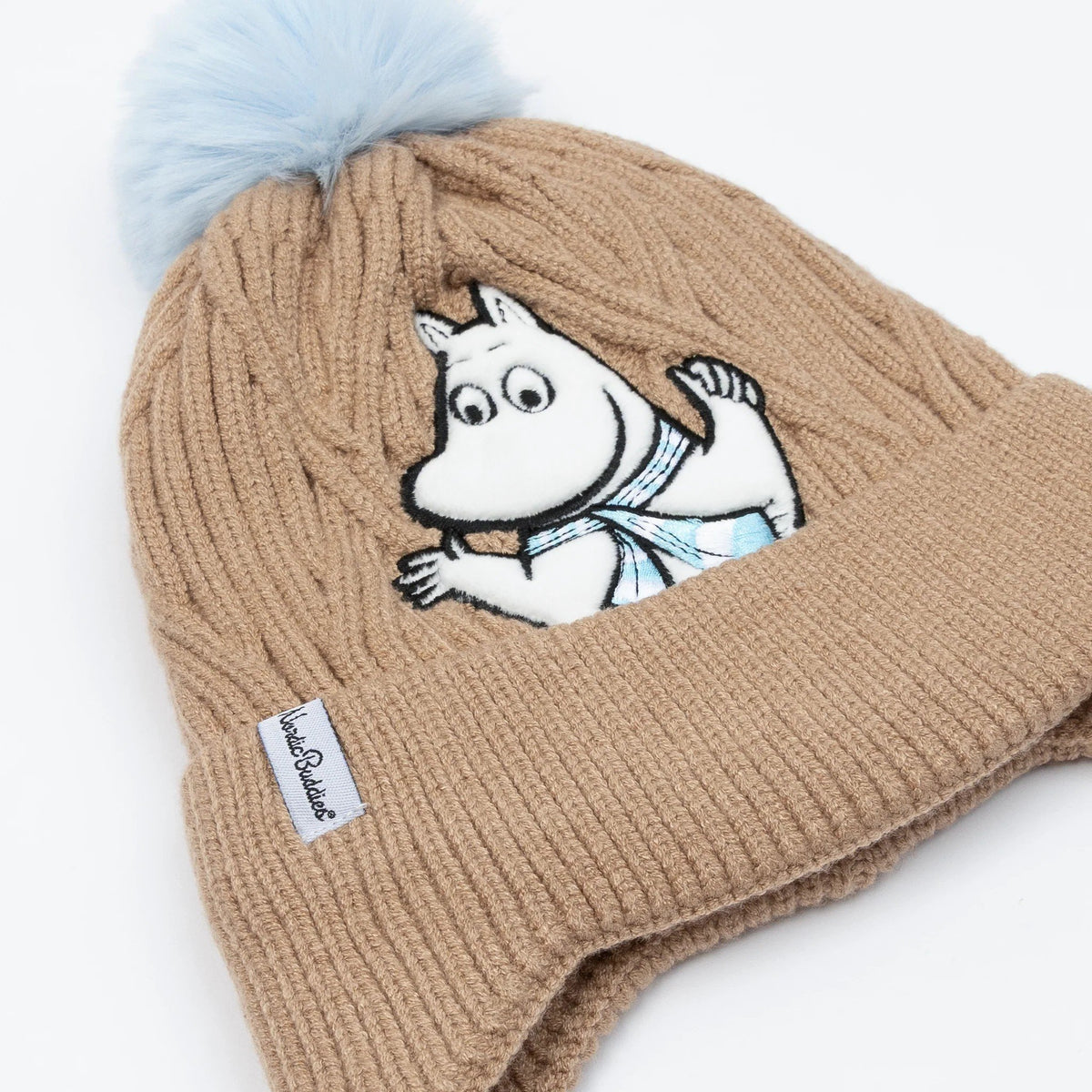2. Brown Moomintroll winter beanie with blue pom-pom and Moomintroll character, showing NordicBuddies label, on white background