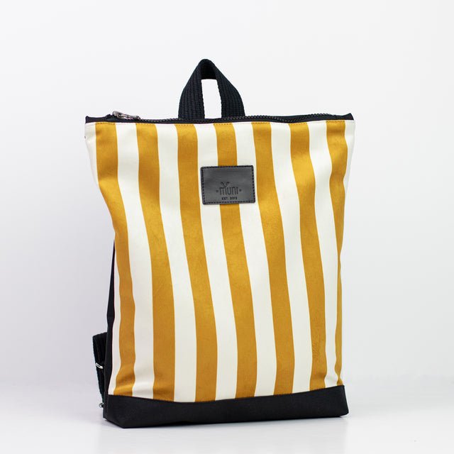 8. Studio shot of Muni striped mustard and white backpack with black straps