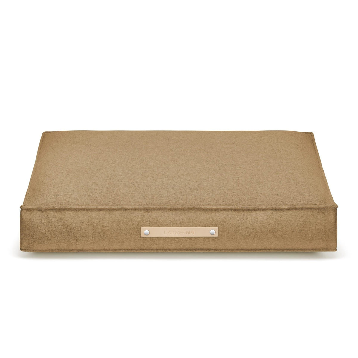 2. Labbvenn Møvik Cushion in biscuit color with leather belt and embossed logo, shown on a white background highlighting its rectangular shape and minimalist design