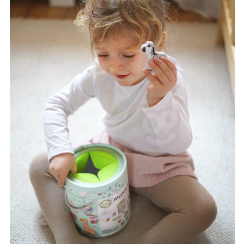 11. Girl smiling while holding zebra shape from Woopie Mystery Box