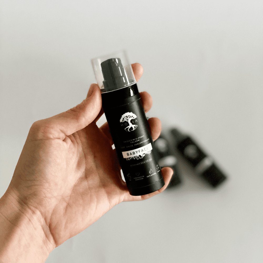 2. HOIA homespa Aftershave Balm for Men 30ML held in hand, showcasing product size and packaging