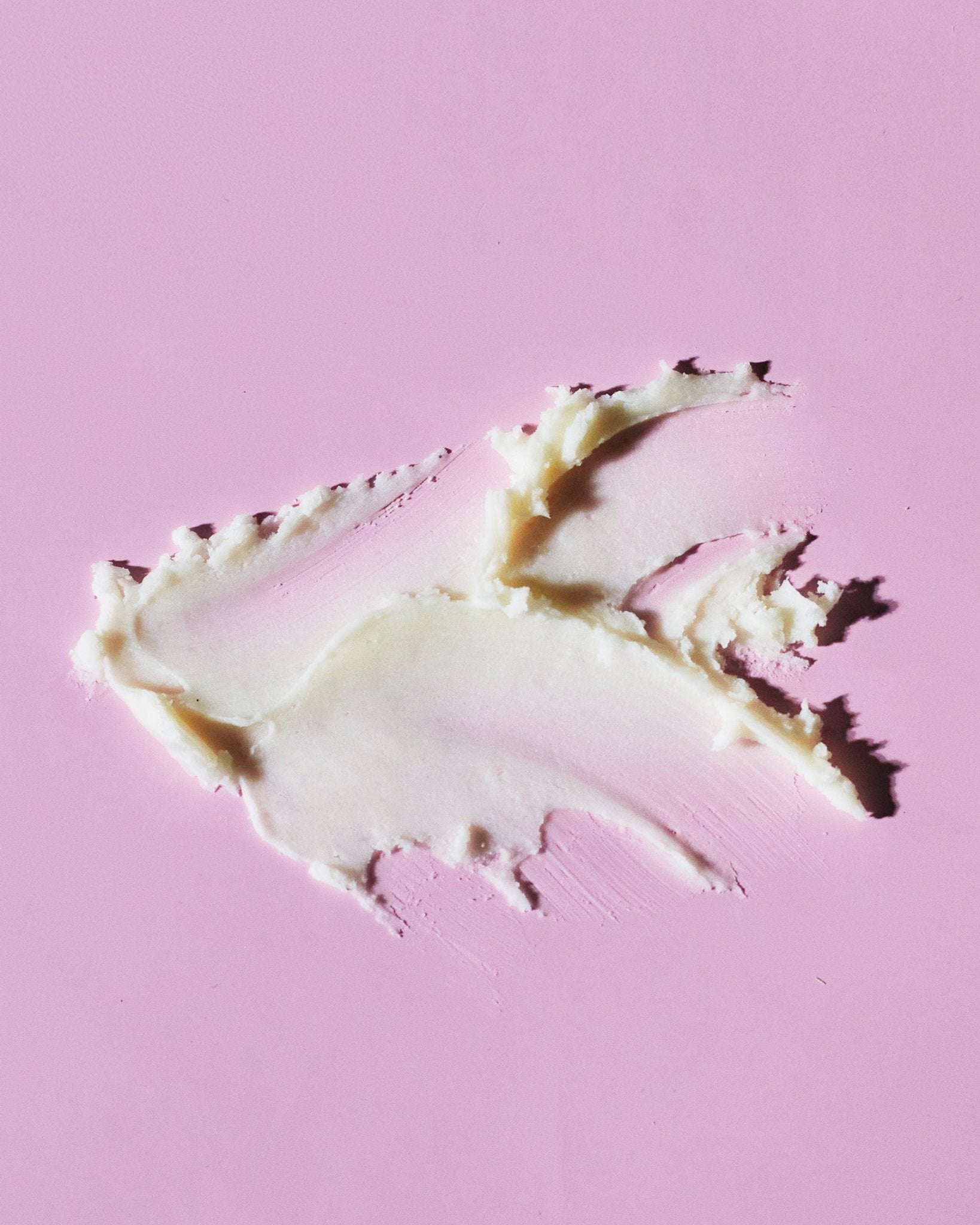 3. Close-up of smooth texture of Nurme Lavender Sage deodorant on a pink surface