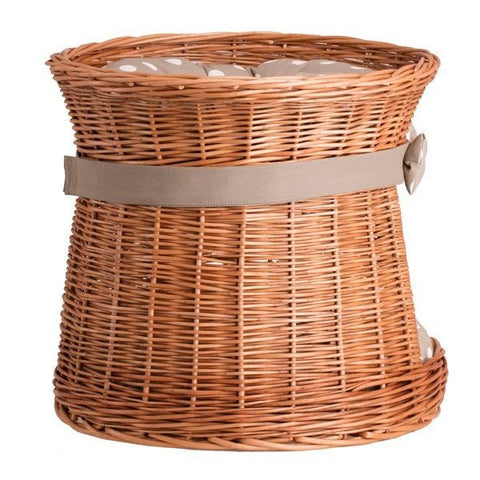 5. Side angle of wicker cat house with polka dot cushion, featuring a bow and sturdy construction.