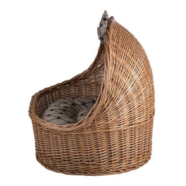 7. Side view of natural wicker pet house with patterned cushion and decorative bow