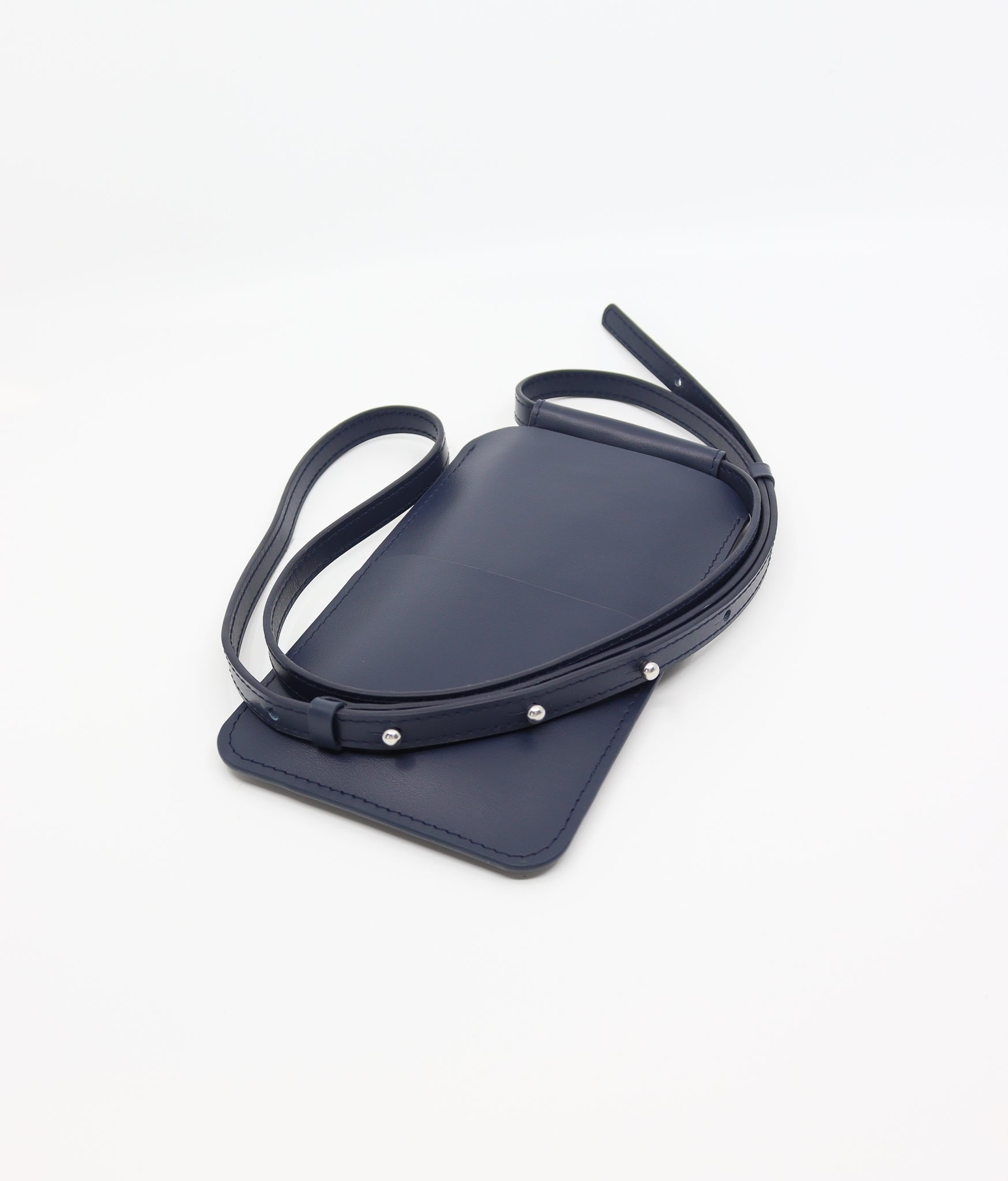 2. Close-up of Tairi Roosve navy leather phone bag with adjustable strap and Sam Browne buttons