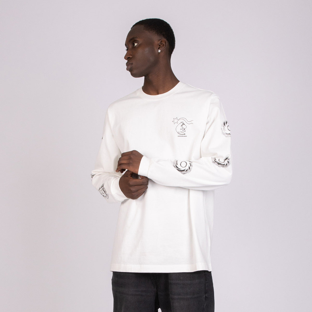3. Men's white Moomin longsleeve shirt with cuffrib, shown in studio with side view