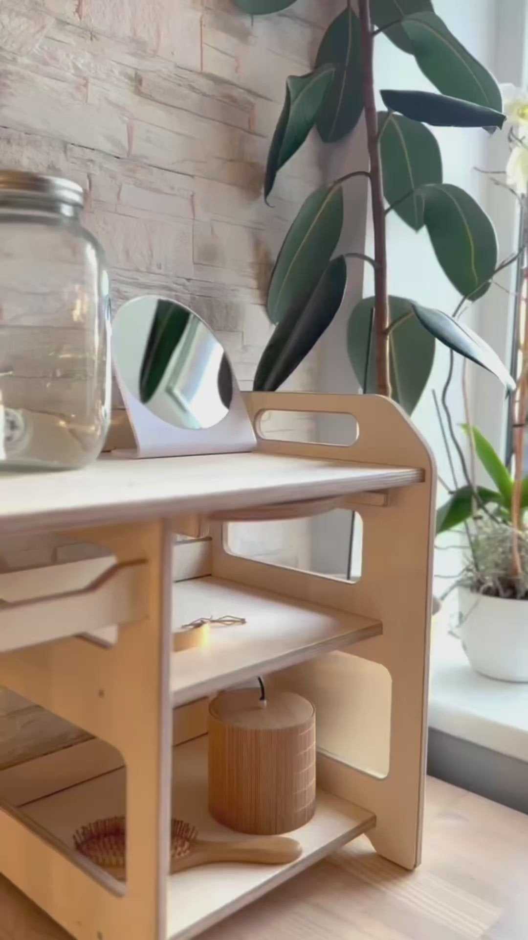5. Side view of Montessori washbasin with storage shelves and plant decor