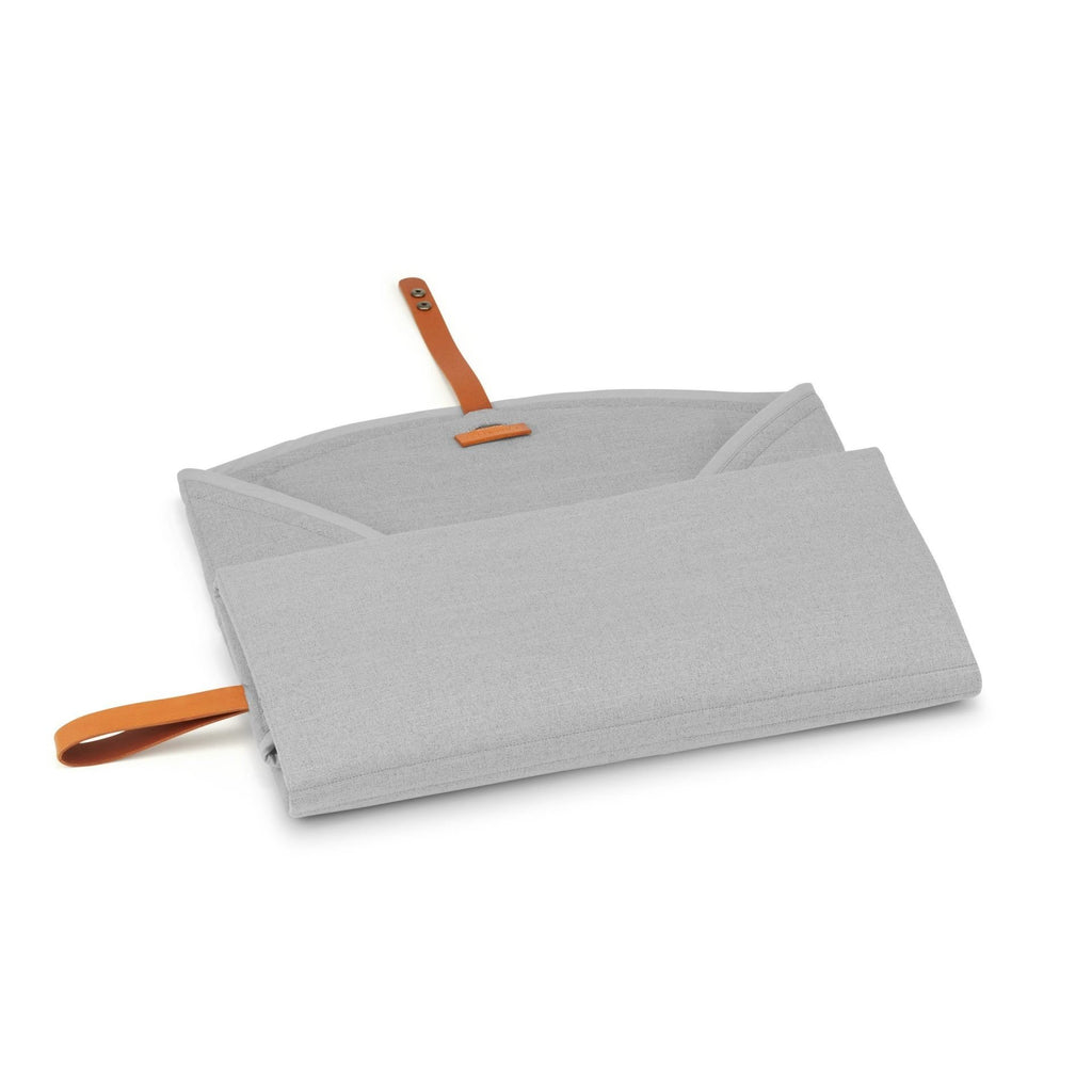 2. Partially unfolded grey Okka travel mat showing interior and brown leather strap
