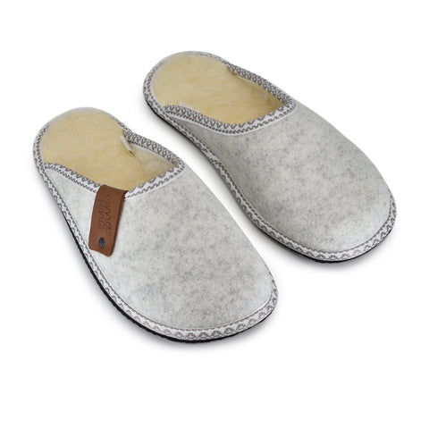 2. Pair of Omaking Halla lambswool and natural felt slippers, displayed in studio setting