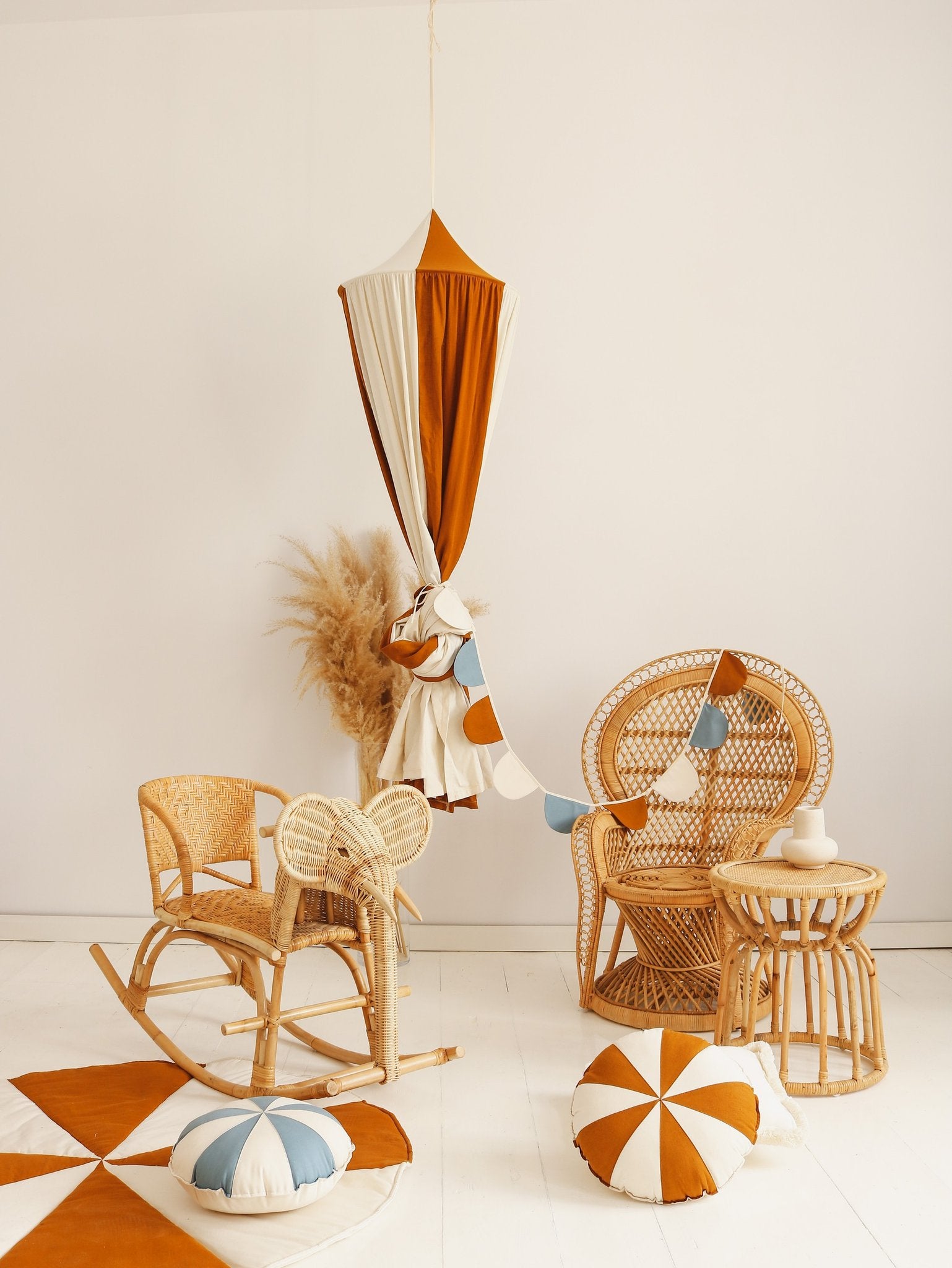 10. Caramel and cream canopy with wicker furniture and cushions in a bright room