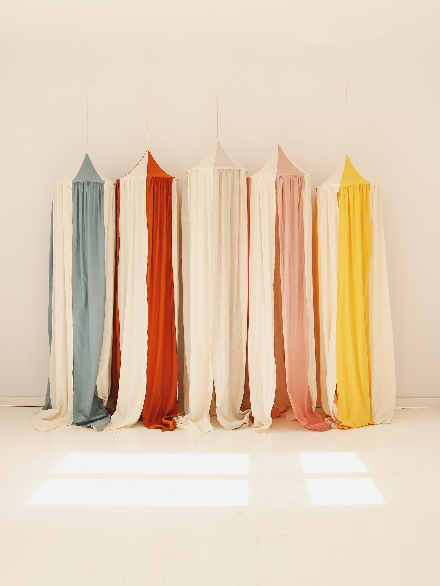 11. Five colorful canopies in a row with sunlight streaming in