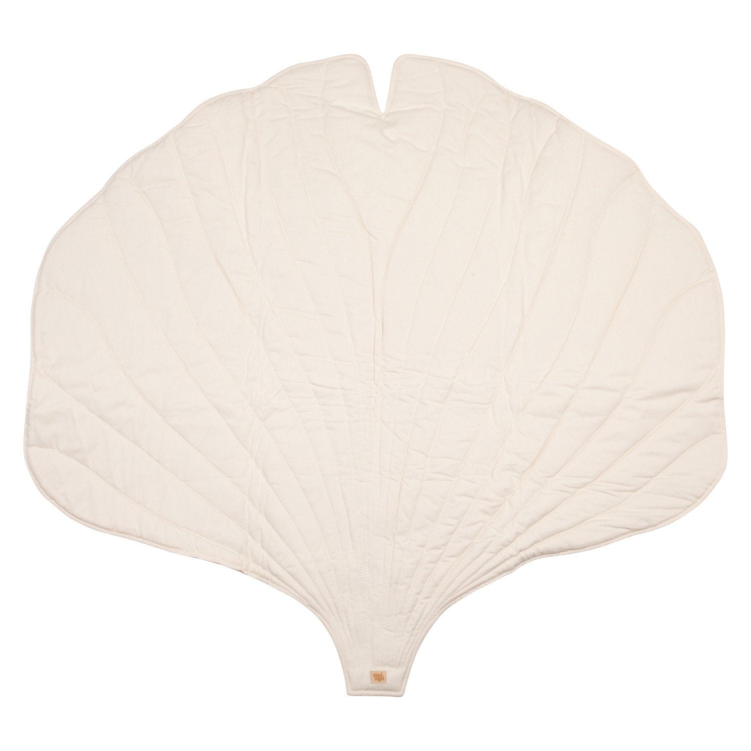 2. Studio shot of white ginkgo leaf-shaped playmat made from organic cotton and linen, showing texture and design