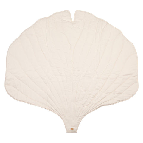 2. Studio shot of white ginkgo leaf-shaped playmat made from organic cotton and linen, showing texture and design