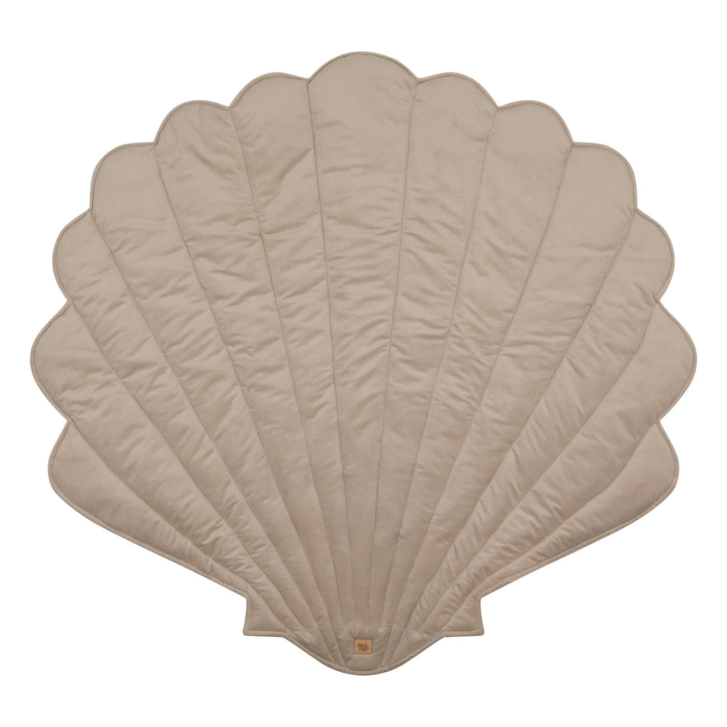 2. Studio shot of beige ginkgo leaf-shaped playmat on white background