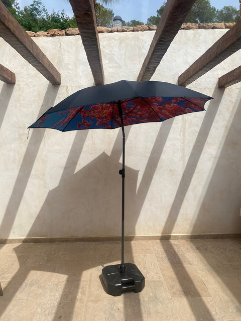 1. HAPPYSWEEDS parasol with black base on sunlit terrace, featuring floral print canopy and wooden beams overhead