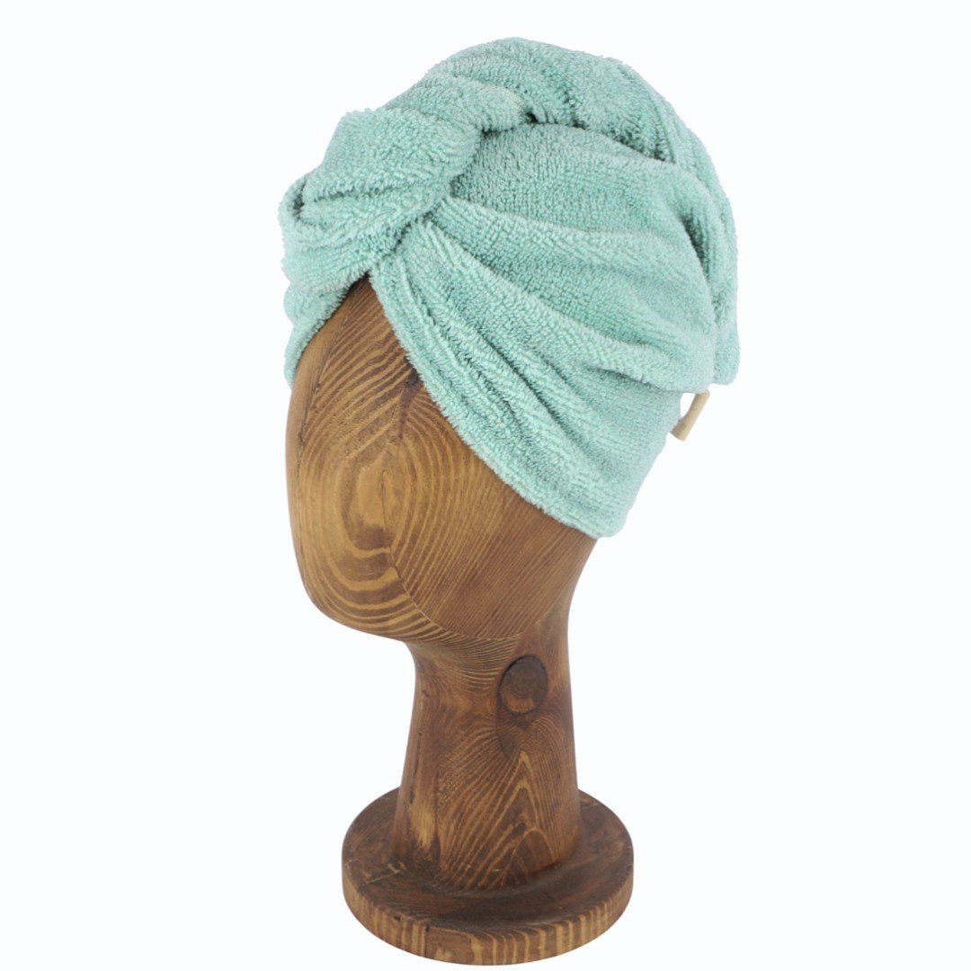 4. Green bamboo-cotton hair turban on wooden mannequin head