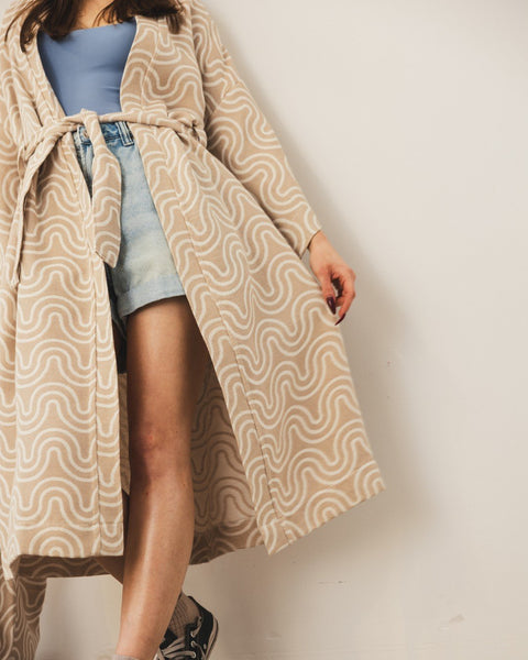 4. Woman in Patulove sand kimono with blue top and denim shorts, showing front view