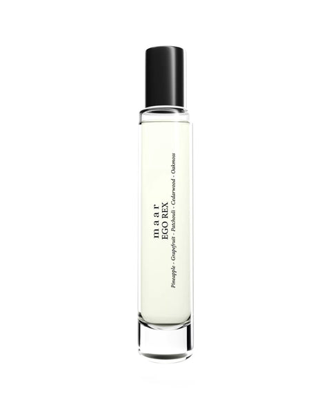 1. Studio shot of maar Ego Rex perfume oil in 10ml clear glass bottle with black cap, featuring pineapple, grapefruit, patchouli, cedarwood, and oakmoss notes