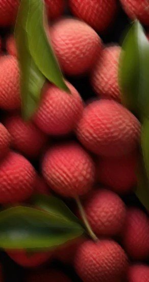 3. Close-up of lychee fruits with green leaves, showcasing key fragrance note